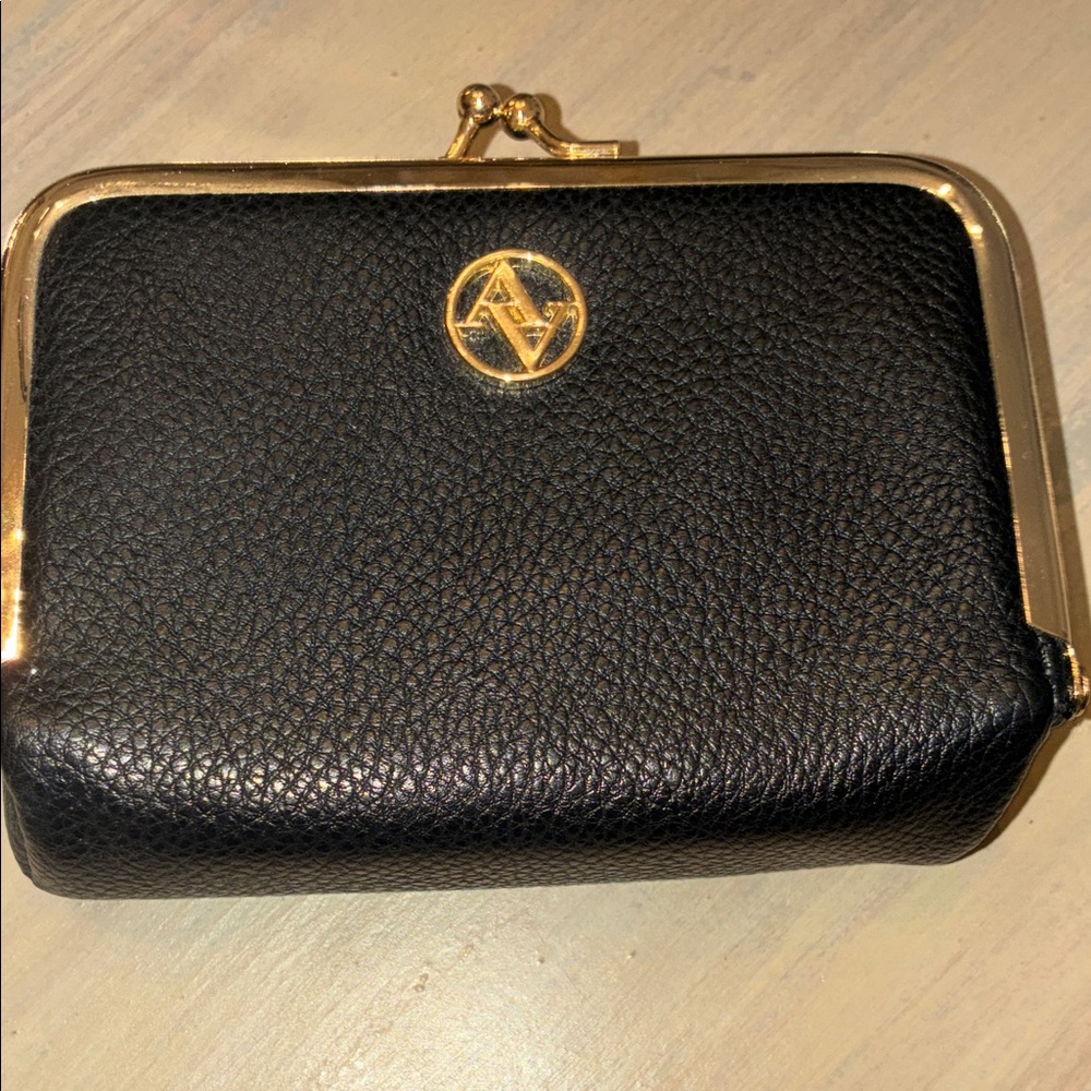 Adrienne Vittadini Black and Gold Pill or coin case.  Lined leather. Never used.